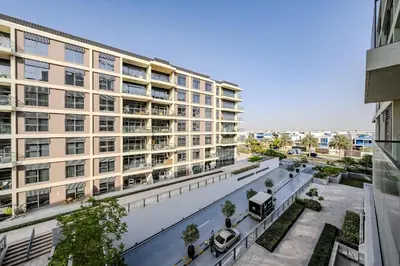 an apartment building with a street in front of it at Modern 2BDR Apartment I Dubai Hills I City View I Mulberry at Park Heights in Dubai