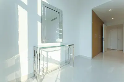 a glass table in a room with a hallway at Beautiful 2BR I Heart of BLVD I Downtown Dubai in Dubai