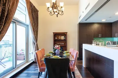 a dining room with a table and chairs at Luxury loft apartment downtown in Dubai