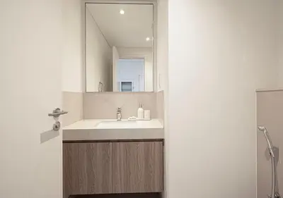 a bathroom with a sink and a mirror at Stylish Burj khalifa view 5 Star 4BD Apartment in Downtown with Dubai Mall access - Brand New Apartment in Dubai