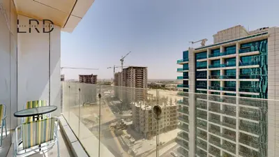 a balcony with a view of a city at Modern & Spacious 2BR Apartment in Dubai