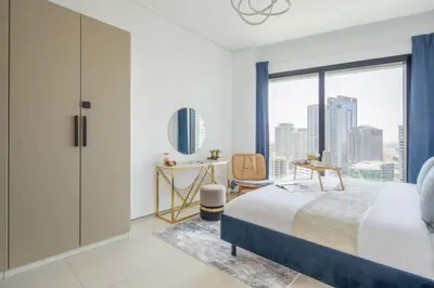 a bedroom with a bed and a large window at Frank Porter - The Address JBR in Dubai