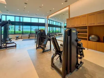 a gym with treadmills and ellipticals in a building at Frank Porter - The Address JBR in Dubai
