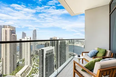 an apartment balcony with a view of the city at Stunning Home in Palace Residences on 41st Floor in Dubai
