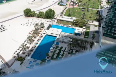 an overhead view of the pool at the miracle beach resort at 3BR Best SeaView JBR Address Beach Resort in Dubai