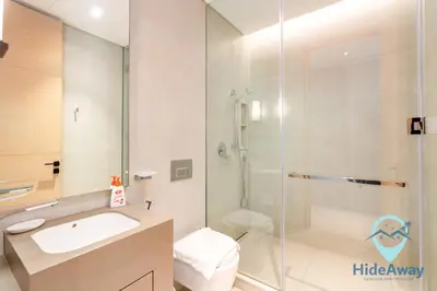 a bathroom with a shower and a sink and a toilet at 3BR Best SeaView JBR Address Beach Resort in Dubai