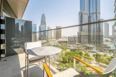 a balcony with a table and chairs and a city at NewArabian Opera Address Residences in Dubai