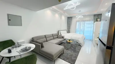 a living room with a couch and a bed at Dubai Marina - Stylish Studio Apartment - Marina Diamond 2 in Dubai