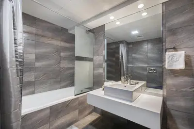 a bathroom with a sink and a mirror at Blueground Sheikh Zayed Rd pool gym DXB-462 in Dubai