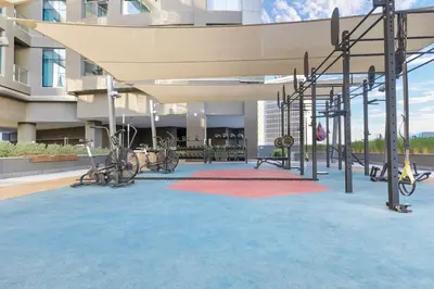 an empty playground in a building with a red carpet at Waves - Stylish 13th-Floor Studio with Top-Notch Amenities in Dubai
