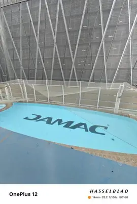 a large swimming pool with the wordarma written on it at Luxurious Apartment 500 Meters Next to Dubai Mall in Dubai