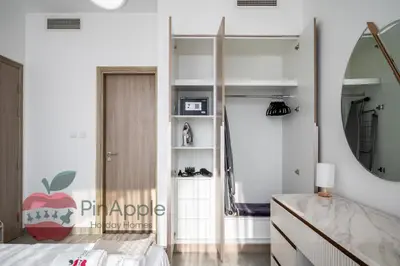 a bedroom with a bed and a mirror at Lux 1BR Direct access to Dubai Marina 4 people in Dubai