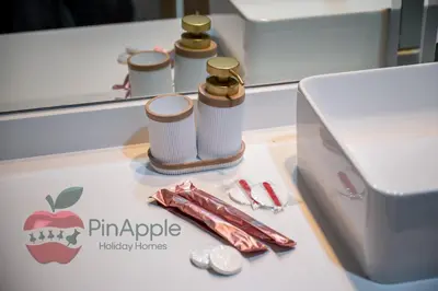a counter with two bottles of apple laboratory items at Lux 1BR Direct access to Dubai Marina 4 people in Dubai