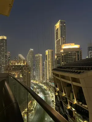 a view of a city skyline at night at Dubai Mall Direct Connection Apartment - Burj Vista in Dubai