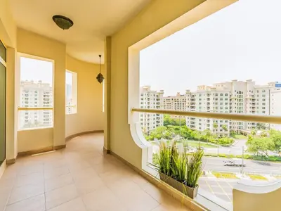 a large room with a large window with a view of a city at Chic 4BR Apt Pool Palm Beach Club Dubai in Dubai