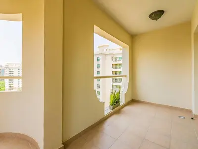 an empty room with a window in a building at Chic 4BR Apt Pool Palm Beach Club Dubai in Dubai