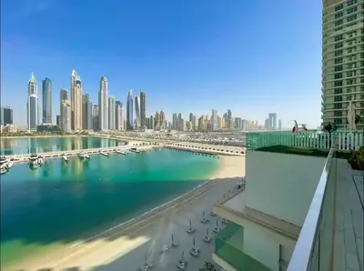a view of the city from the balcony of a building at AWS Holiday Homes - Memories by the Beach in Dubai
