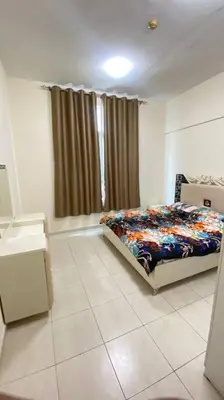 a bedroom with a bed in a room with a window at Furnished Apartment in Silicon Oasis on Prime Location in Dubai
