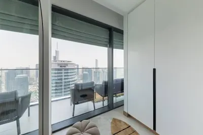 a room with a large window with a view of the city at Vida Dubai Marina Residences in Dubai