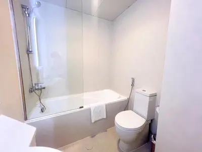 a bathroom with a tub and a toilet and a shower at Stunning 2BR In Dubai Marina With Amazing views in Dubai