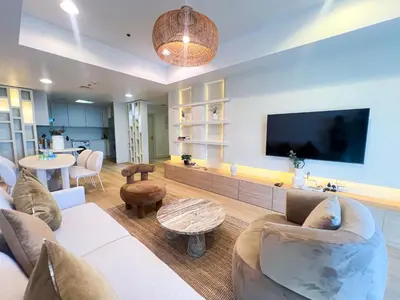 a living room with a couch and a flat screen tv at Stunning 2BR In Dubai Marina With Amazing views in Dubai