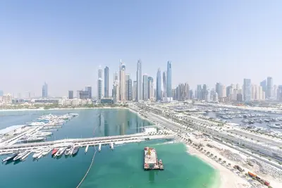 an aerial view of a harbor with a city at Luxury Living with Private Beach in Dubai