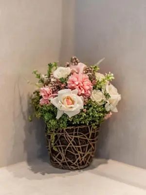 a vase filled with pink and white flowers at Chic 4 Bedroom Apartment I Burj Khalifa & Fountain Views I Direct Access to Dubai Mall I Free Gym, Pool, Parking Wi-Fi and PS5 I by Skyline Serenity in Dubai