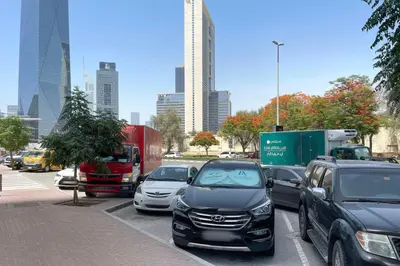 a bunch of cars parked in a parking lot at Blueground DIFC pool gym DXB-468 in Dubai