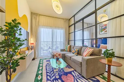 a living room with a couch and a table at Colorful1BR Apartment in Dubai Hills Next to Mall in Dubai