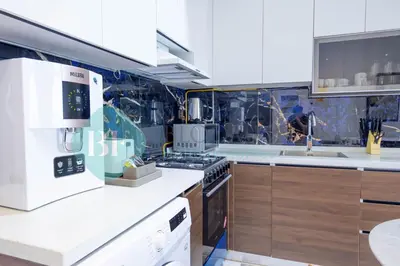 a kitchen with a stove and a sink at Bloomfields Elegant Stu Jewelz in Dubai