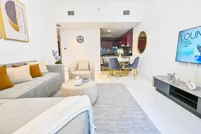 a living room with a couch and a table at Iconic Sea View Marina - LUX NEW in Dubai
