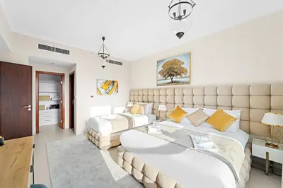 a large bedroom with two beds and a couch at Ace Luxe, 2BR, Downtown, Burj Khalifa & Dubai Fountain view, 5 mins walk to Dubai Mall in Dubai