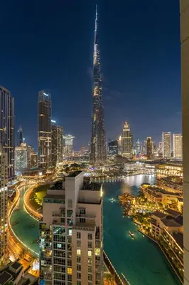 a view of a city skyline at night at Ace Luxe, 2BR, Downtown, Burj Khalifa & Dubai Fountain view, 5 mins walk to Dubai Mall in Dubai