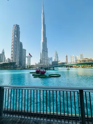 a view of the city from the river at Ace Luxe, 2BR, Downtown, Burj Khalifa & Dubai Fountain view, 5 mins walk to Dubai Mall in Dubai