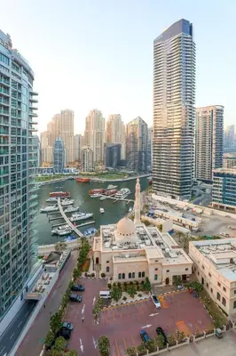 a view of a city with a harbor and buildings at Superb 1Bed Marina View pool JBR Beach Parking in Dubai