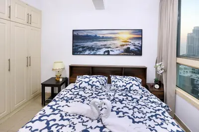 a bedroom with a bed with two hearts on it at Superb 1Bed Marina View pool JBR Beach Parking in Dubai