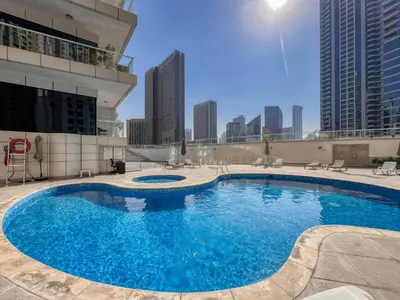 a large swimming pool on top of a building at ShoresInn - Magnificent 1BR in Dubai Marina in Dubai