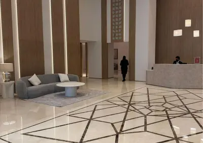 a lobby with a couch and a table in a building at Luxurious 2BR I Burj Khalifa View I Downtown Dubai in Dubai