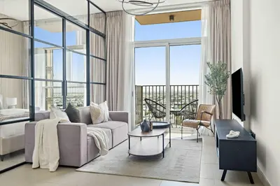 a living room with a couch and a table at Silkhaus in Collective Tower Luxorious 2BDR in Dubai