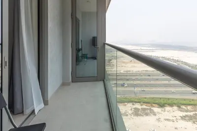 a room with a view of an airport at Ahlan HH - Luxury 2BR in Sobha Creek Vistas in Dubai