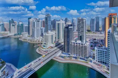 an aerial view of a city with a bridge at ShoresInn - Waterfront in Heart of Dubai Marina in Dubai