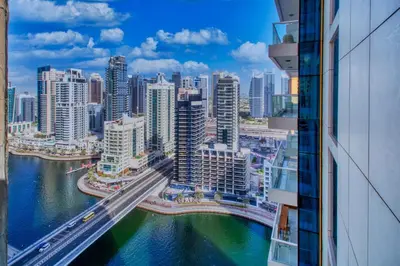 a view of a city with a river and buildings at ShoresInn - Heavenly Escape with Marina View in Dubai