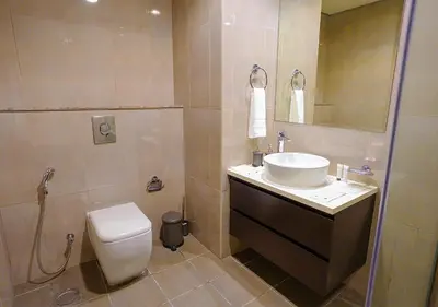 a bathroom with a sink and a toilet at NiceVisit Merano 1BD Business Bay in Dubai