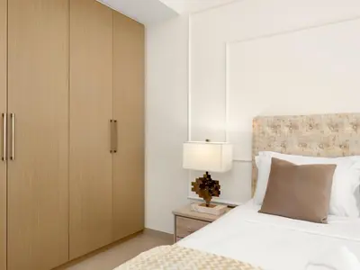 a bedroom with a large bed and a cabinet at Burj Khalifa View Luxe 2BR, 5 Mins walk to Dubai Mall in Dubai