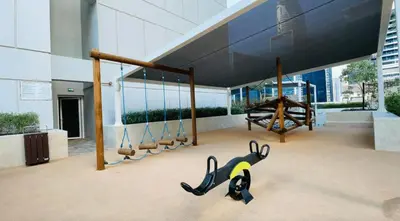 a playground with a monkey and a swing at AWS Holiday Homes - Lux Gateaway near Dubai Mall in Dubai