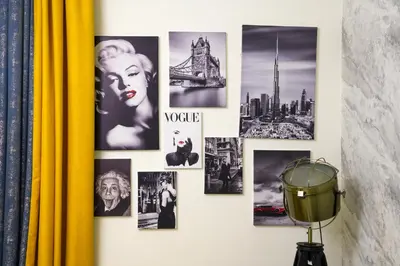 a wall with pictures offamousfamous cities on it at CH Skyline Retreat - Cozy 1BR Apt With Burj Khalifa and Fountain Views in Dubai