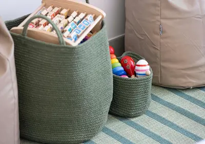 two baskets filled with different types ofcoloredental at Kinfolk Homes - 5-Star Family Stay, 8 Minutes Walk to Dubai Mall & Burj Khalifa in Dubai