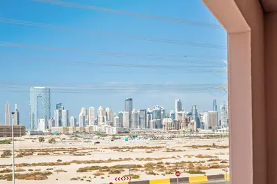 a view of a city skyline from a building at Sunny Studio Perfect For Discovery Gardens Stays in Dubai