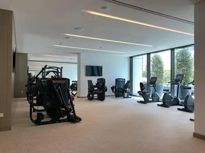 a gym with many exercise equipment in a building at Elegant Luxury Living in Palace Residences in Dubai