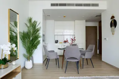 a dining room with a table and chairs at Elegant Luxury Living in Palace Residences in Dubai